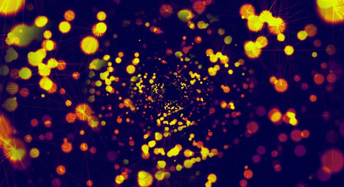 A swarm of orange and yellow glowing dots linked by faint web lines on deep navy